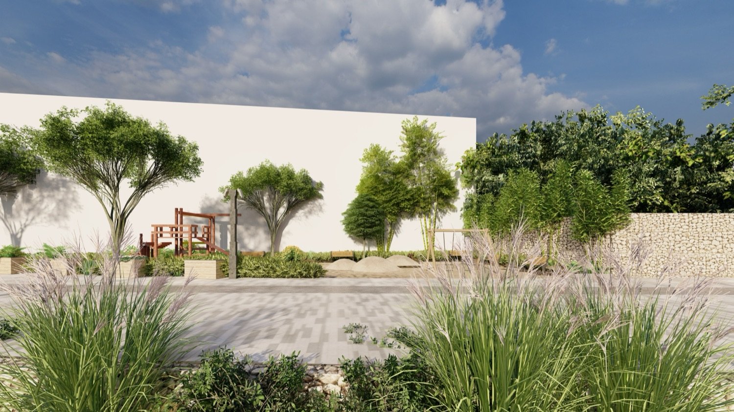 Garden pocket with ornamental grasses and small trees against a light wall