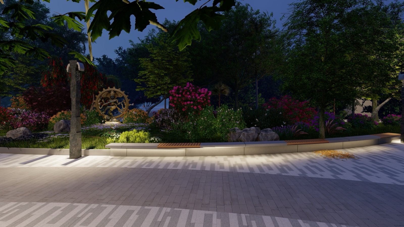 Planting bed lit from below at night beside the curved paved walk