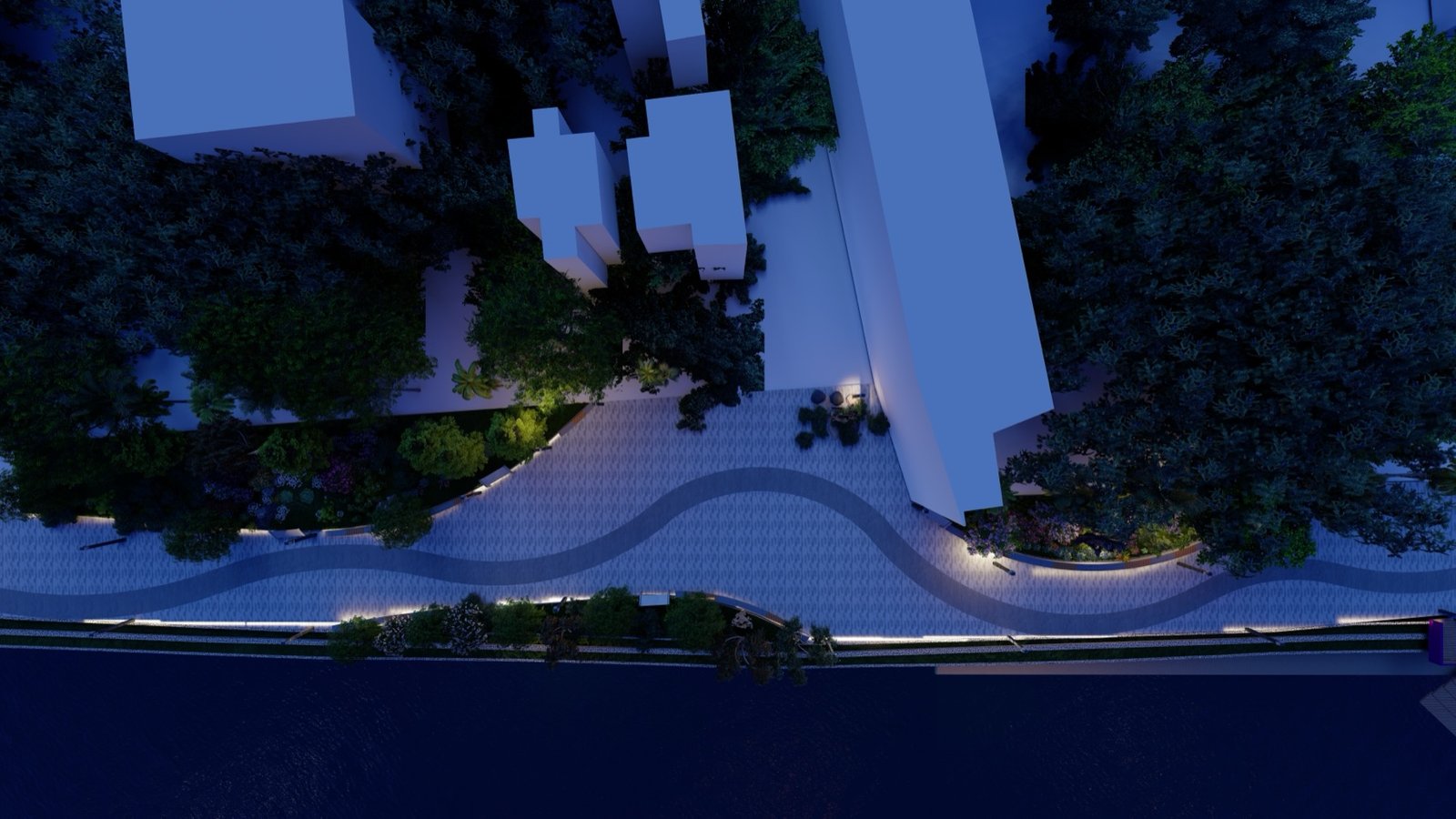 Aerial night view of the lit promenade curving along the dark river